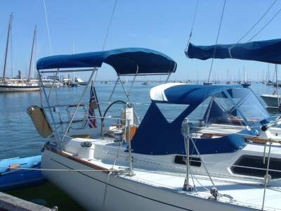 Gemini Marine Products strapless bimini on small sail boat.