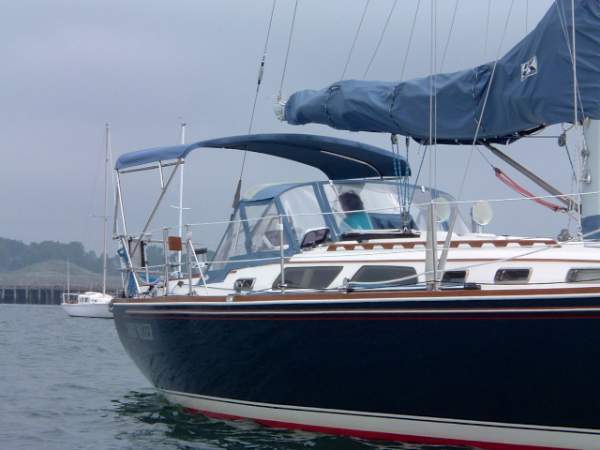 Large strapless bimini top on a sailboat.