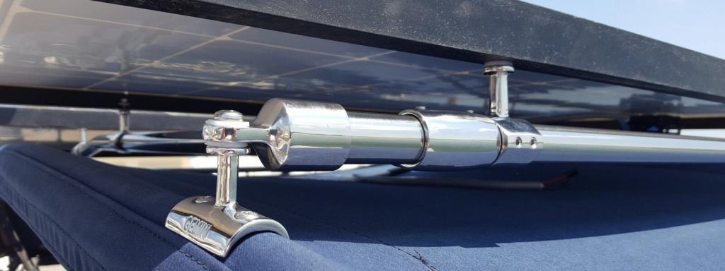 Gemini Marine Products concave rail mounts support a rigid solar panel